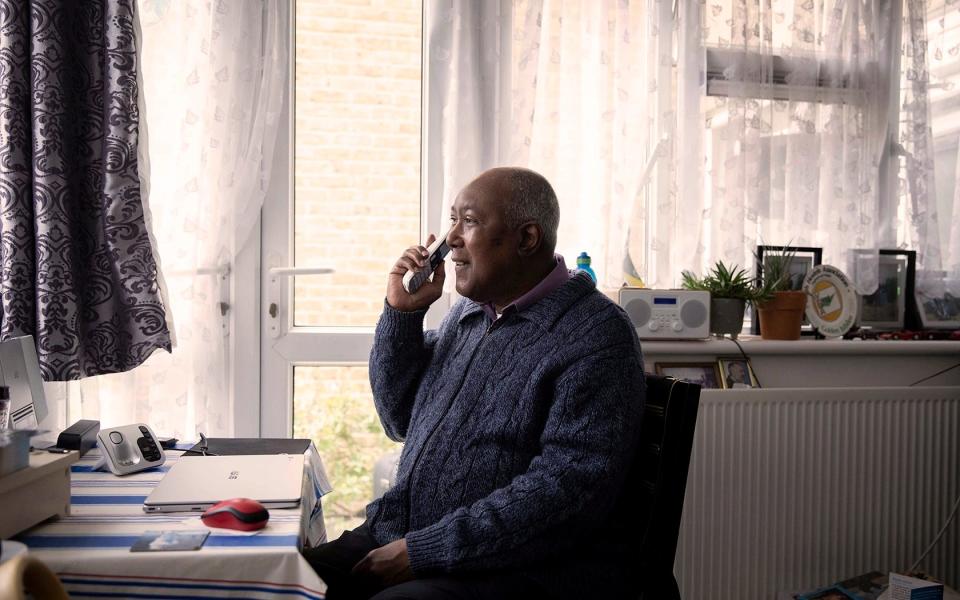 Age UK helps isolated people like Michael to socialise through its telephone befriending service - ABBIE TRAYLER-SMITH