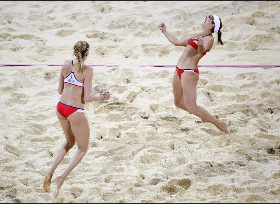 Misty May-Treanor reacts after she and teammate Kerri Walsh Jennings beat April Ross and Jennifer Kessy during the women's Gold Medal beach volleyball match between two United States teams at the 2012 Summer Olympics, Wednesday, Aug. 8, 2012, in London. 