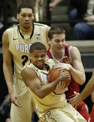 Purdue freshman guard P.J. Thompson wrestles for a rebound with Indiana’s Nick Zeisloft during the Boilermakers’ 83-67 victory on Wednesday.