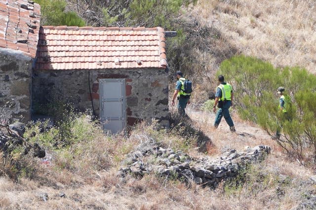 Members of a search and rescue team near a buiilding