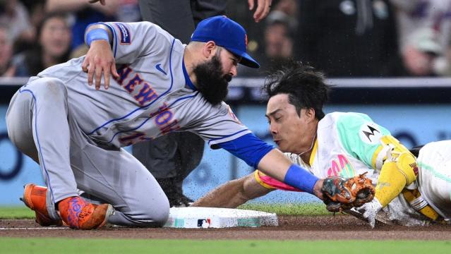 Jul 7, 2023; San Diego, California, USA; San Diego Padres second base Ha-seong Kim (7) is tagged out at third base by New York Mets third baseman Luis Guillorme (13) attempting to stretch a double during the seventh inning at Petco Park.