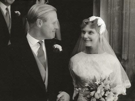 A newlywed couple in a black and white photograph.