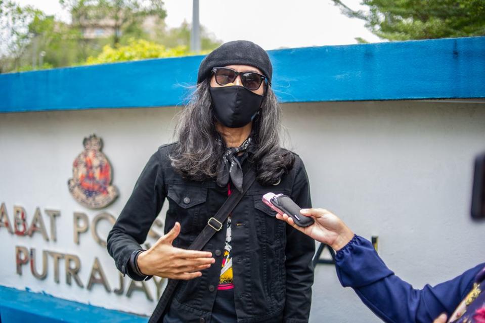 File picture shows activist Fahmi Reza speaking to a reporter outside the Putrajaya district police headquarters March 10, 2021. — Picture by Shafwan Zaidon