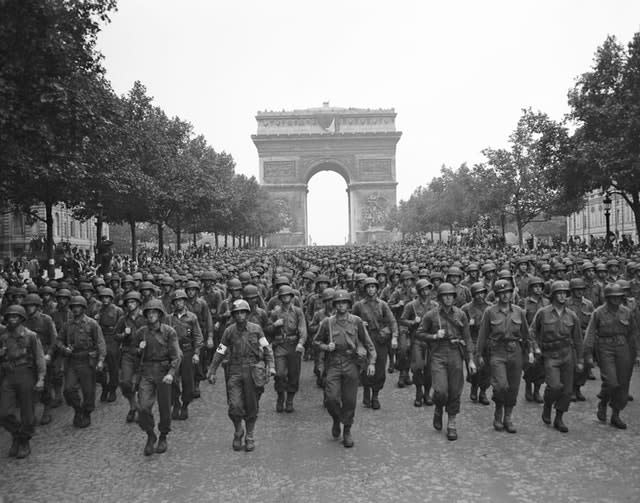 US soldiers march along the Champs Elysees after the liberation of Paris