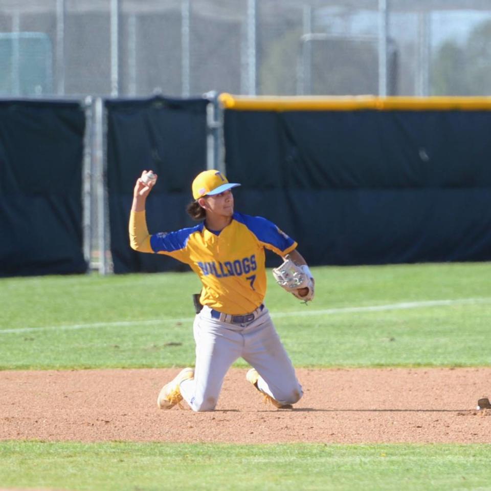 Turlock third baseman Andrew Lujan makes a throw after a diving play during a CCAL matchup with Enochs at Enochs High School in Modesto, Calif. on Friday, April 19, 2024.