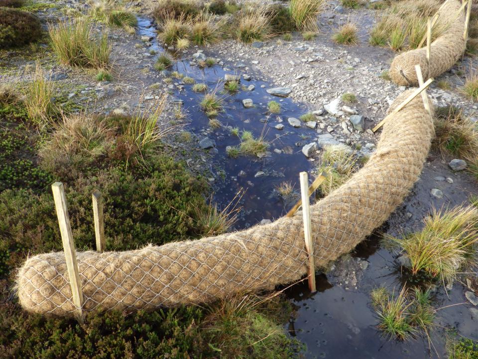 Coir log dam on West Arkengarthdale to help rewet the peat (Rosie Snowden/PA)