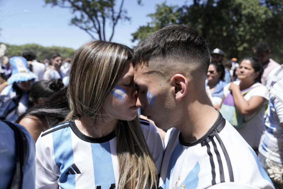 Argentine soccer fans react to France scoring a goal during the World Cup final soccer match between Argentina and France in Buenos Aires, Argentina, Sunday, Dec. 18, 2022. (AP Photo/Rodrigo Abd)