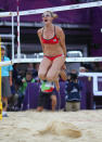 LONDON, ENGLAND - AUGUST 07: Kerri Walsh Jennings of the United States celebrates after winning match point during the Women's Beach Volleyball Semi Final match between United States and China on Day 11 of the London 2012 Olympic Games at Horse Guards Parade August 7, 2012 in London, England. (Photo by Ryan Pierse/Getty Images)