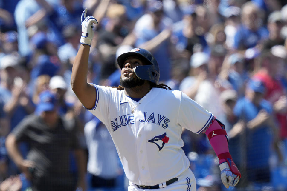 Toronto Blue Jays first baseman Vladimir Guerrero Jr. (27) celebrates his two-run home run during the first inning of a baseball game against the Cleveland Guardians in Toronto, Sunday, Aug. 27, 2023. (Frank Gunn/The Canadian Press via AP)