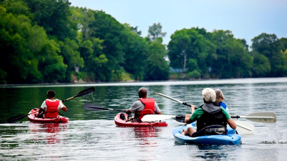 Group of seniors kayaking on the water.