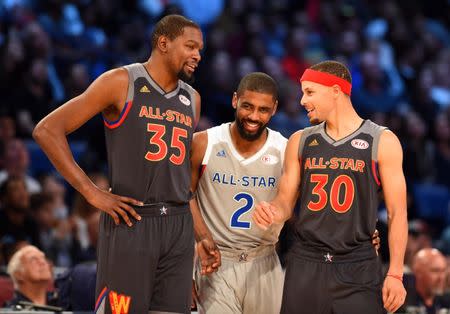 Feb 19, 2017; New Orleans, LA, USA; Western Conference forward Kevin Durant of the Golden State Warriors (35), Eastern Conference forward Kyrie Irving of the Cleveland Cavaliers (2) and Western Conference guard Stephen Curry of the Golden State Warriors (30) talk in the 2017 NBA All-Star Game at Smoothie King Center. Mandatory Credit: Bob Donnan-USA TODAY Sports