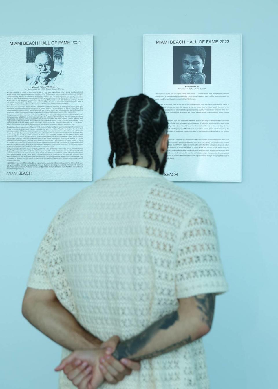 Nico Ali Walsh, the grandson of Muhammad Ali, reads the inscription that details his grandfather’s induction into the Miami Beach Hall of Fame in Miami Beach, Florida on Wednesday, June 26, 2024. The 23-year-old was excited to visit the Miami Beach Convention Center considering it was where his grandfather won his first heavyweight title.