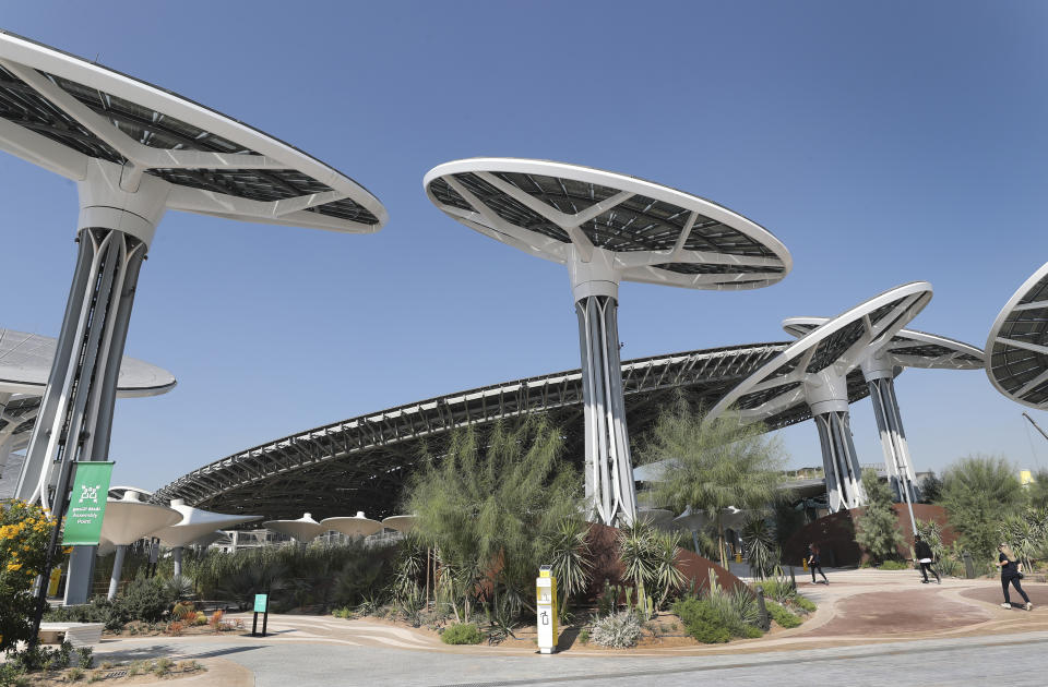 Journalists arrive for visiting Terra, The Sustainability Pavilion, during a media tour at the Dubai World Expo site in Dubai, United Arab Emirates, Saturday, Jan. 16, 2021. With the inauguration of Expo 2020 Dubai, the next world's fair, nine months away amid the raging global pandemic that forced its postponement, organizers unveiled the site's signature pavilion to reporters for the first time on Saturday. (AP Photo/Kamran Jebreili)