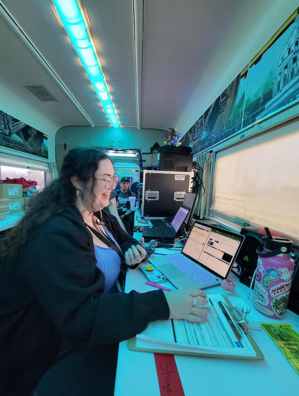 Katy Sullivan, stage manager for the Oklahoma City "Polar Express Train Ride," tracks an afternoon performance as she rides in the production car on a recent Saturday. The popular yuletide attraction runs through Dec. 27 at the Oklahoma Railway Museum in Oklahoma City.