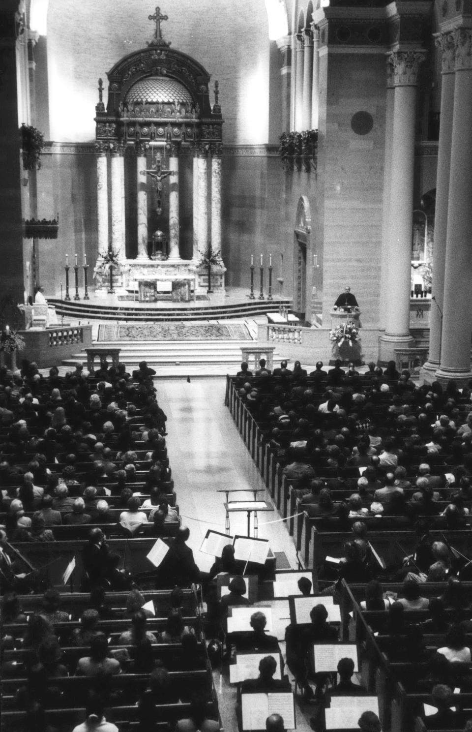 Margaret Hawkins, founding conductor of the Milwaukee Symphony Chorus and the Wisconsin Conservatory Chamber Singers, is eulogized by Archbishop Rembert Weakland at a memorial service at the Cathedral of St. John the Evangelist. This is a 1993 Press Photo.