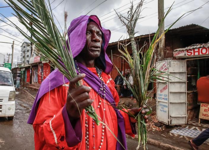 Members of the Legio Maria Church march along the streets of Kibera during a Palm Sunday celebrations on April 2, 2023 in Nairobi, Kenya.