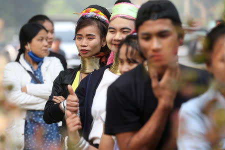 Ethnic Kayan also known as long neck villagers arrive at a polling station in Ban Huadua school to cast their vote for the general election in Mae Hong Son, Thailand, March 24, 2019. REUTERS/Ann Wang