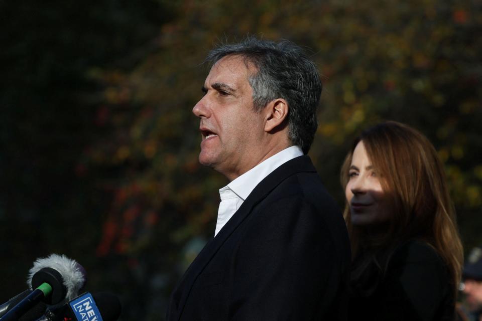 Michael Cohen speaks to reporters after leaving New York Supreme Court on 25 October. (REUTERS)