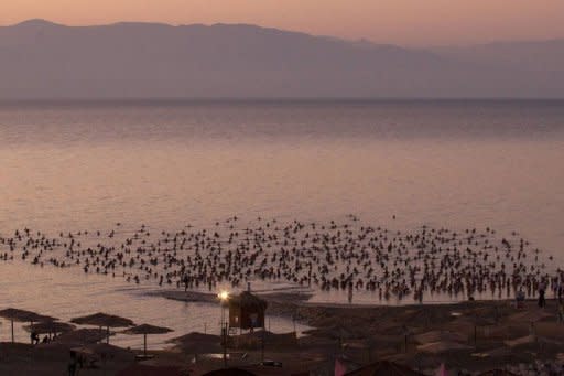 More than 1,000 floating nude Israelis pose for US art photographer Spencer Tunick's first Middle East mass shoot on September 17 in the Dead Sea, the lowest spot on earth which experts warn could dry out by 2050 unless urgent steps are taken to halt its demise
