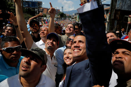 Venezuelan opposition leader and self-proclaimed interim president Juan Guaido and opposition leader Henrique Capriles attend a rally against Venezuelan President Nicolas Maduro's government in Caracas, Venezuela February 2, 2019. REUTERS/Carlos Barria