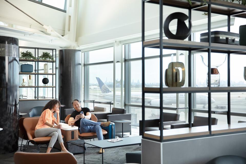 Seating and foosball inside the United EWR C3 United Club