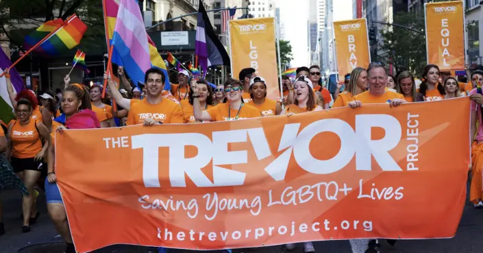 Trevor Project volunteers march in New York City&#39;s Pride parade.