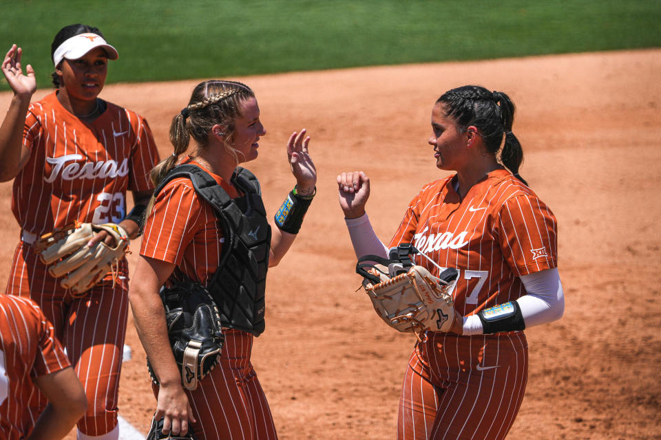 Texas catcher Reese Atwood, left, greets pitcher Citlaly Gutierrez during a NCAA Tournament win over Texas A&M last season. The two sophomore return as anchors of the 2024 team.