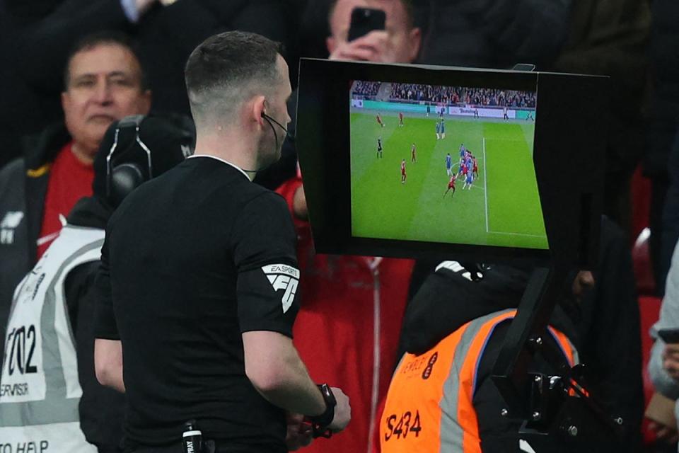 VAR check: Referee Chris Kavanagh checks the pitch-side monitor (AFP via Getty Images)