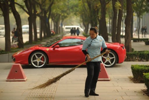 Photo illustration shows a Ferrari parked in Beijing. China's leadership has been hit by a fresh scandal ahead of a 10-yearly power handover, with reports a close ally of the president was demoted following his son's involvement in a fatal Ferrari crash