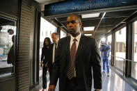 Former Minneapolis FBI agent Terry Albury, followed by his attorney, Joshua Dratel, walk out of the Federal Courthouse in St. Paul Thursday, Oct. 18, 2018 after Albury was sentenced to four years in prison for leaking classified defense documents to a reporter. (Shari L. Gross/Star Tribune via AP)