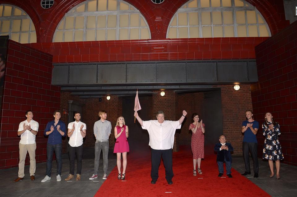 Oliver Phelps, James Phelps, Matthew Lewis, Domhnall Gleeson, Evanna Lynch, Robbie Coltrane, Helena Bonham Carter, Warwick Davis, Tom Felton and Bonnie Wright attend The Wizarding World of Harry Potter Diagon Alley Grand Openingat Universal Orlando on June 18, 2014 in Orlando, Florida