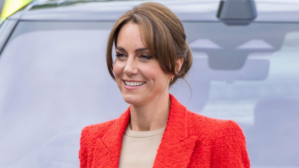 Princess Kate walking in a red blazer
