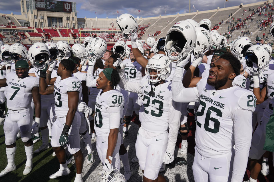 Michigan State players celebrate following an NCAA college football game against Indiana, Saturday, Oct. 16, 2021, in Bloomington, Ind. Michigan State won 20-15. (AP Photo/Darron Cummings)