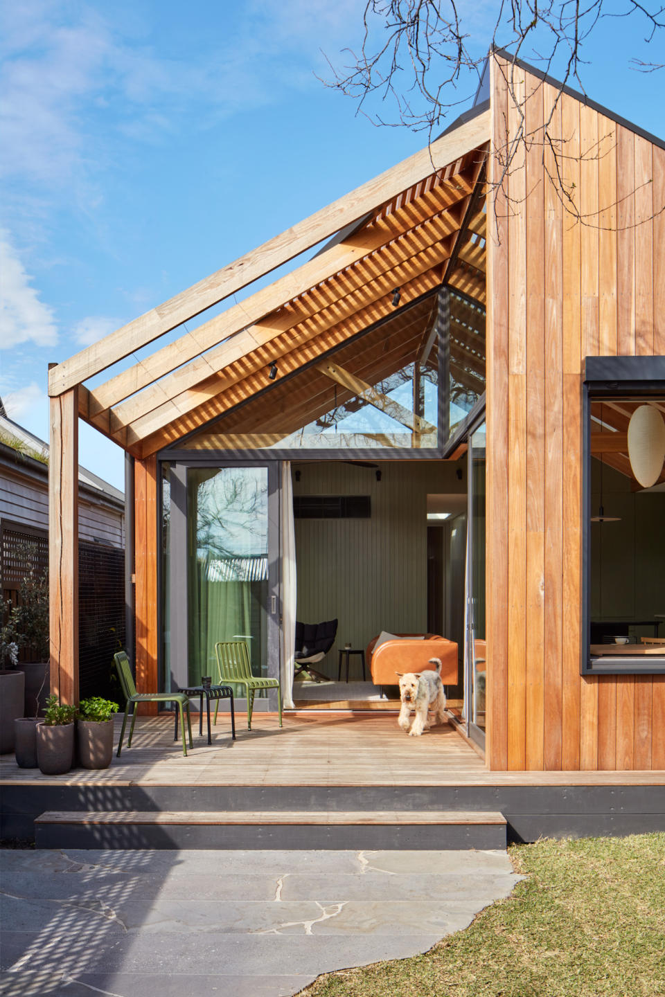 A wooden terrace with accompanying furniture