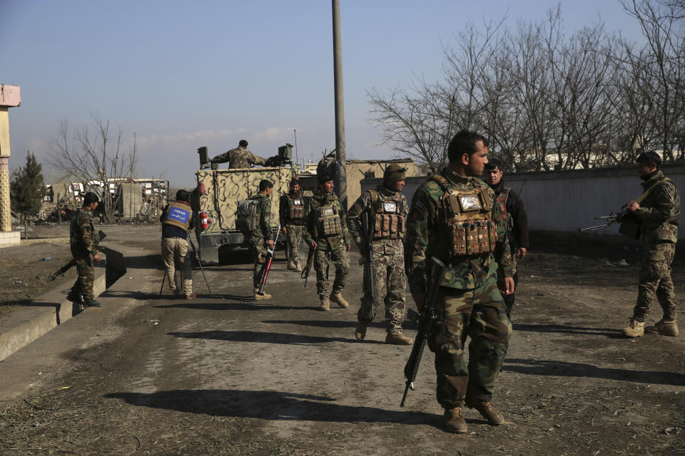 Security personnel arrive near the site of an attack near the Bagram Air Base in Parwan province of Kabul, Afghanistan, Wednesday, Dec. 11, 2019. A powerful suicide bombing Wednesday targeted an under-construction medical facility near the Bagram Air Base, the main American base north of the capital Kabul, the U.S. military said. (AP Photo/Rahmat Gul)