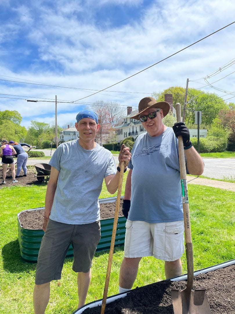 The Rev. Timothy Crellin, left, and parishioner Bruce Harris plant a community garden at St. Paul's Episcopal Church in Gardner.