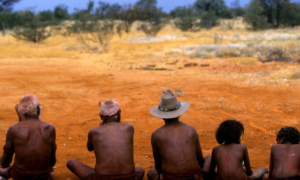 Aboriginal Australians wait for a traditional dance to begin in the near Alice Springs.