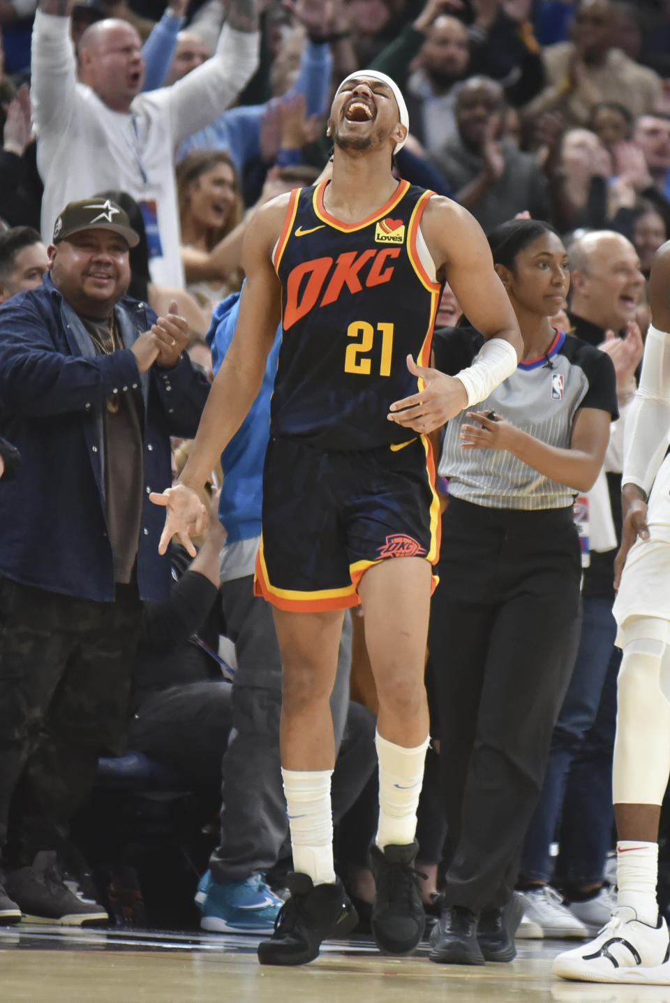 Oklahoma City Thunder guard Aaron Wiggins (21) celebrates during overtime of an NBA basketball game against the Toronto Raptors, Sunday, Feb. 4, 2024, in Oklahoma City. (AP Photo/Kyle Phillips)