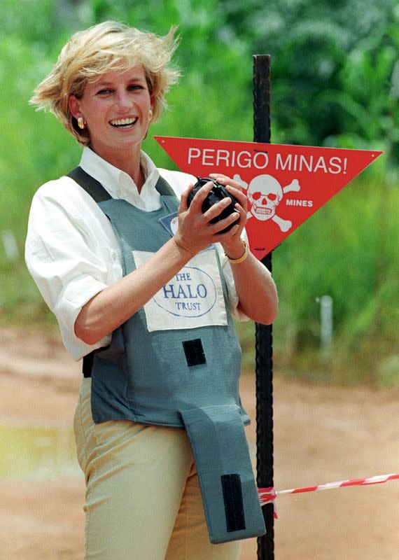 FILE PHOTO: Britain's Princess Diana holds a landmine on a visit to Angola