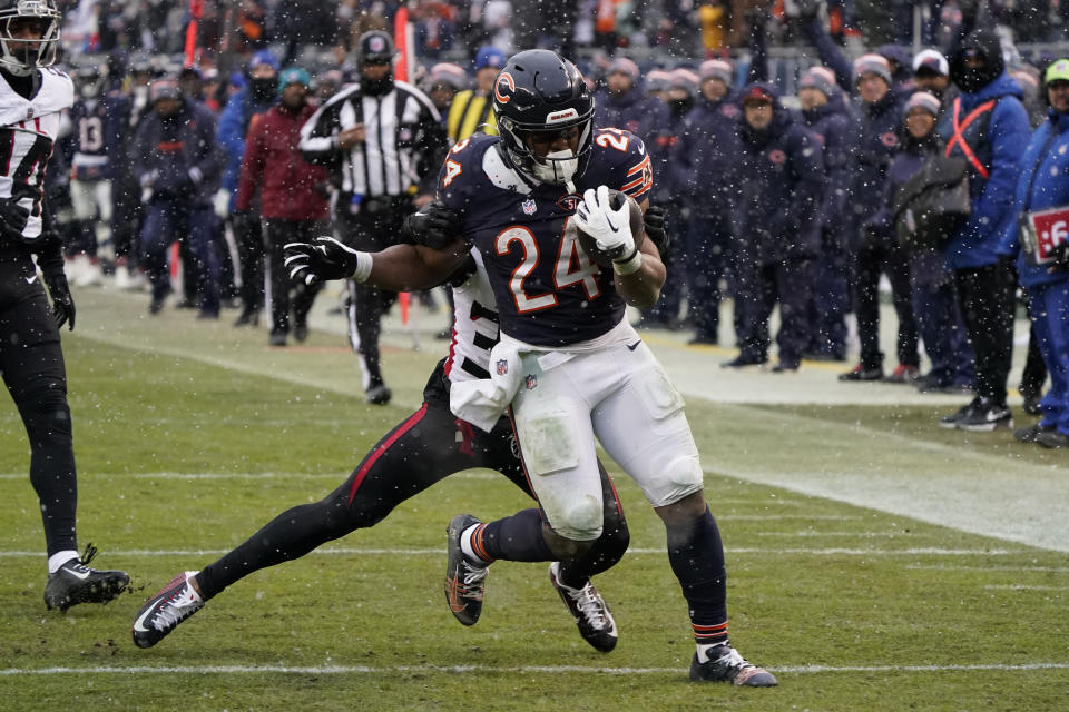 Chicago Bears running back Khalil Herbert (24) runs the ball in the second half of an NFL football game against the Atlanta Falcons in Chicago, Sunday, Dec. 31, 2023. (AP Photo/David Banks)