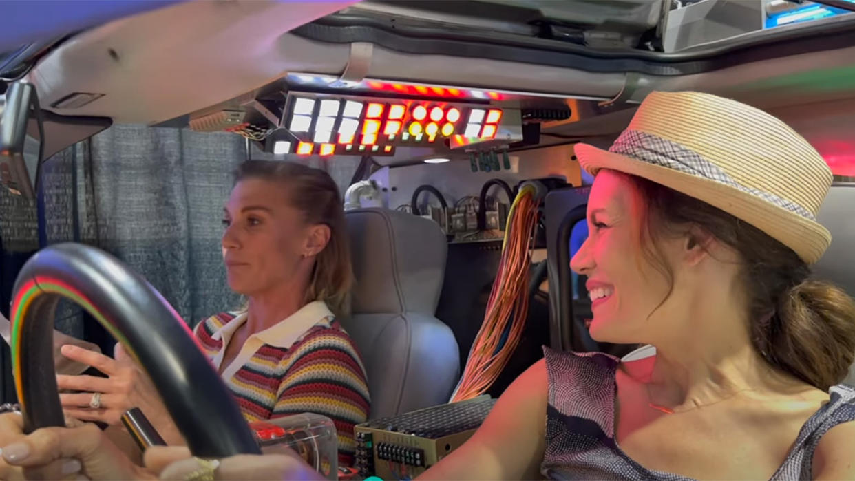  Katee Sackhoff and Emily Swallow in a DeLorean at a Star Wars Fan Event. 