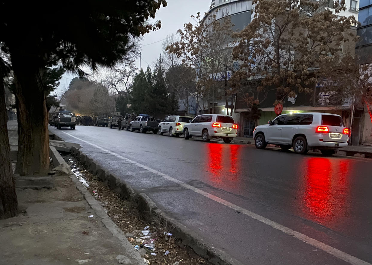 Taliban fighters inspect in the site of an attack in the city of Kabul, Afghanistan, Monday, Dec. 12, 2022. A Taliban official says that a hotel building has come under a complex attack in the Afghan capital Kabul. (AP Photo/Sidiqullah Khan)