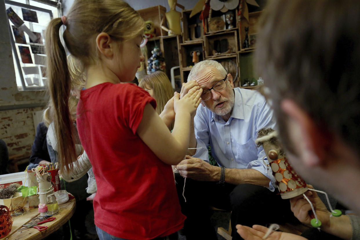 Labour leader Jeremy Corbyn during a visit to the Scrap Creative Reuse Arts Project while on the General Election campaign trail in Leeds, England, Saturday, Nov. 9, 2019. British political leaders are swapping blame over floods that have drenched parts of England as the deluge becomes an issue in the campaign for the Dec. 12 election. (Nigel Roddis/PA via AP)