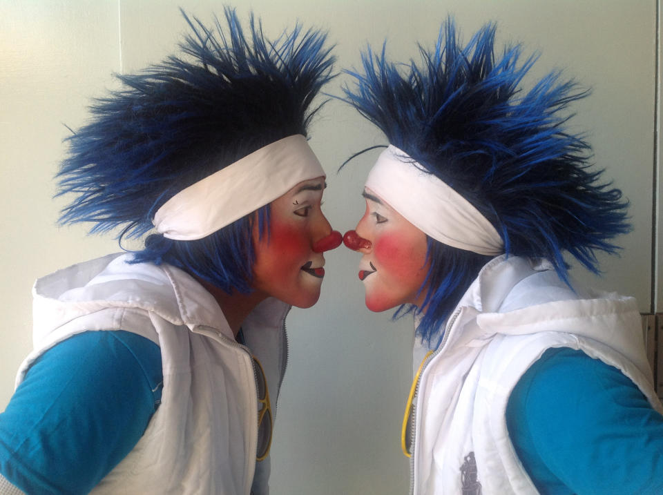 Los Chanclitias of Guatemala; Caitio, 21, and his brother Lunarsito, 20, pose for photos during Mexico's 17th annual clown convention, La Feria de la Risa, in Mexico City, Wednesday, Oct. 24, 2012. Approximately 500 clowns gathered at two local theaters in the capital city to exchange ideas, compete for laughs and show off their comedy performances. The Auguste clown duo have been performing for 11 years. (AP Photo/Anita Baca)