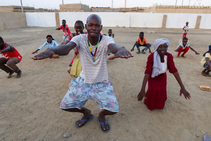 FILE PHOTO: General Kidi, a member of the Nuba Mountain Sound band, trains children to dance, in Port Sudan