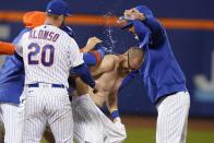 New York Mets' Patrick Mazeika is congratulated by teammates after he drove in the winning run against the Baltimore Orioles in a baseball game Tuesday, May 11, 2021, in New York. The Mets won 3-2. (AP Photo/Frank Franklin II)