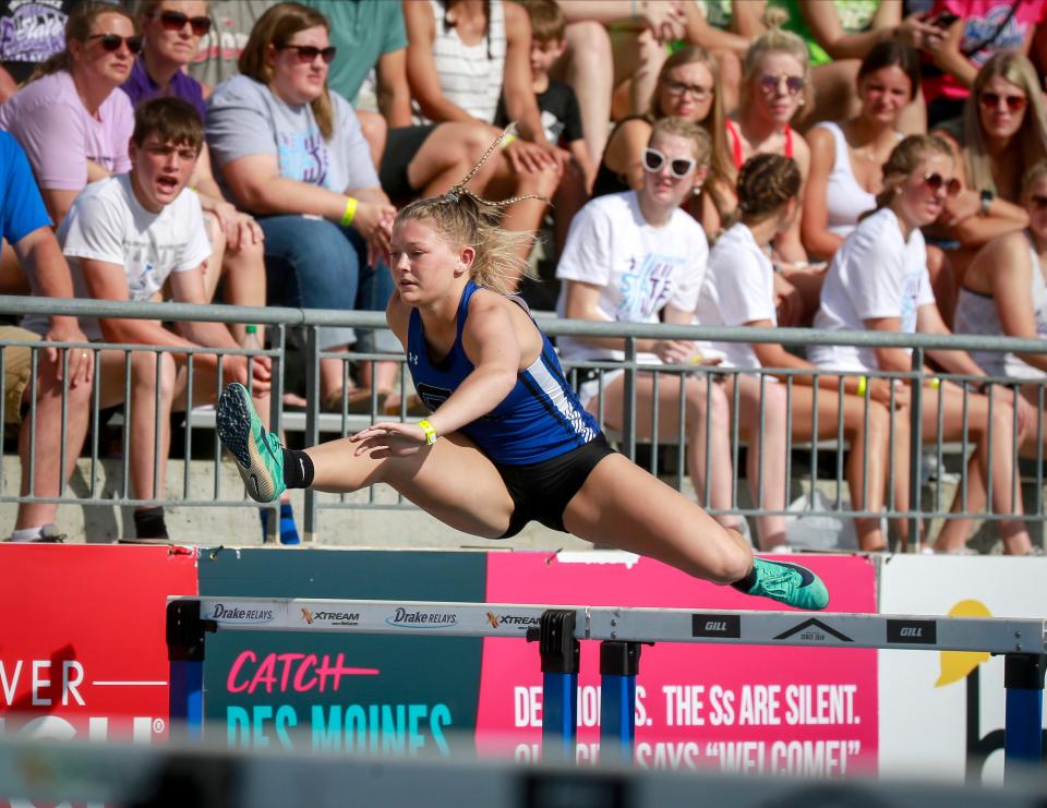 Collins-Maxwell's Gracie Leslie clears a hurdle in the Class 1A shuttle hurdle preliminary event during the Iowa high school state track and field meet at Drake Stadium in Des Moines on Thursday, May 19, 2022.