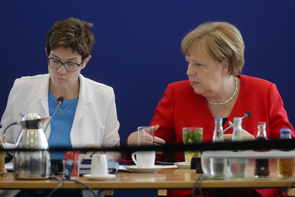 German Chancellor Angela Merkel and Christian Democratic Union, CDU, chairwoman Annegret Kramp-Karrenbauer attend a parties board meeting at the headquarters in Berlin, Monday, May 27, 2019. Germany's governing parties slid to their worst post-World War II showing in a nationwide election at the European Parliament elections yesterday. Merkel's center-right Union bloc drops down from 35.4 to 28.9 percents. (AP Photo/Markus Schreiber)