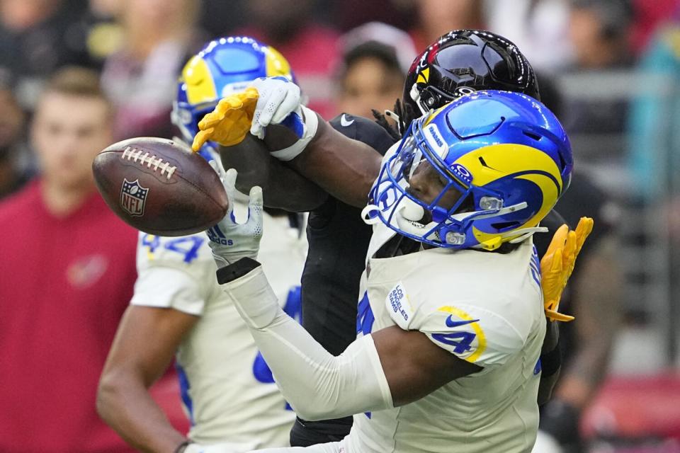 Rams safety Jordan Fuller (4) breaks up a pass intended for the Cardinals' Marquise Brown.