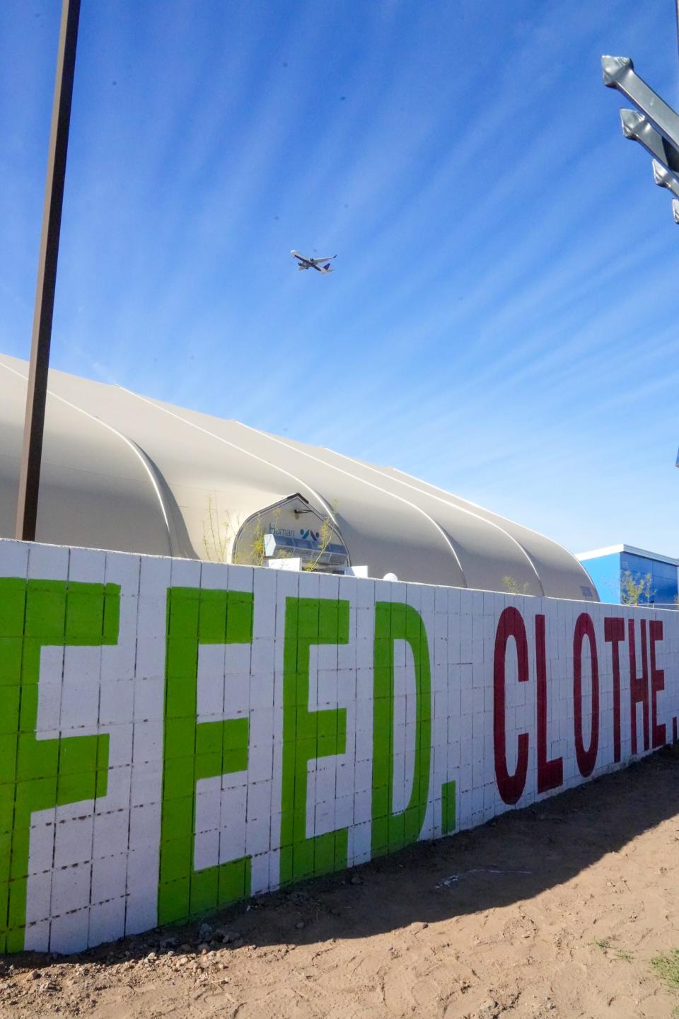 Human Services Camp Inc. opens a 6,300-square-foot, tent-like overnight shelter on the corner of Ninth Avenue and Jackson Street in Phoenix on March 25, 2022.